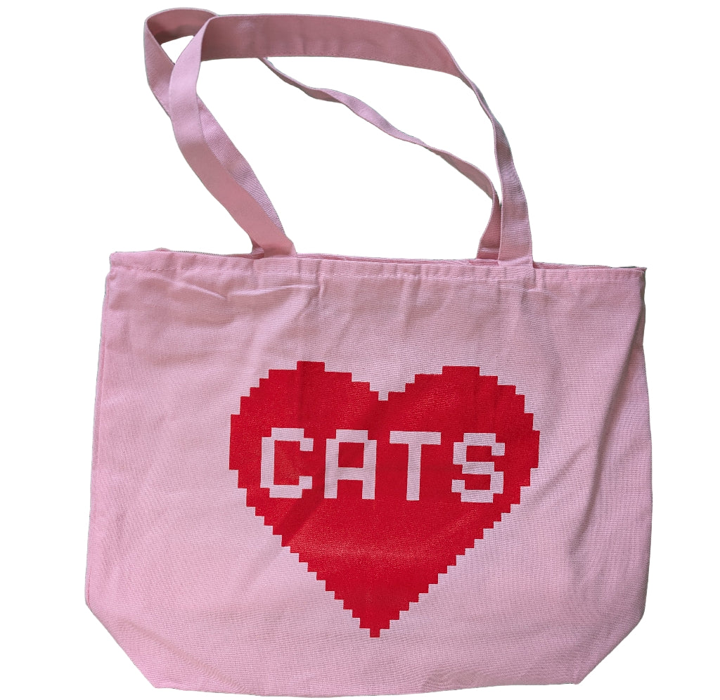 Pink tote bag with a red heart and 'CATS' text on a white background
