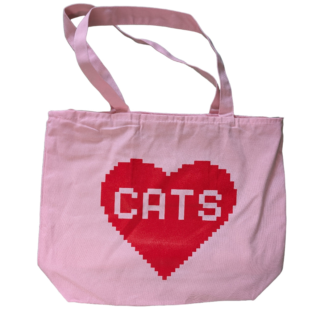Pink tote bag with a red heart and 'CATS' text on a white background