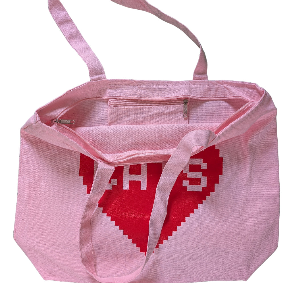 Pink tote bag with a red heart that says "cats"