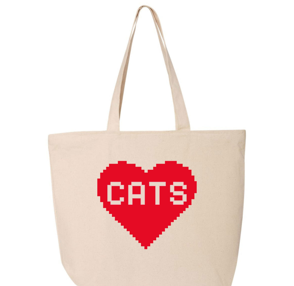 Beige tote bag with a red heart and 'CATS' text on a white background
