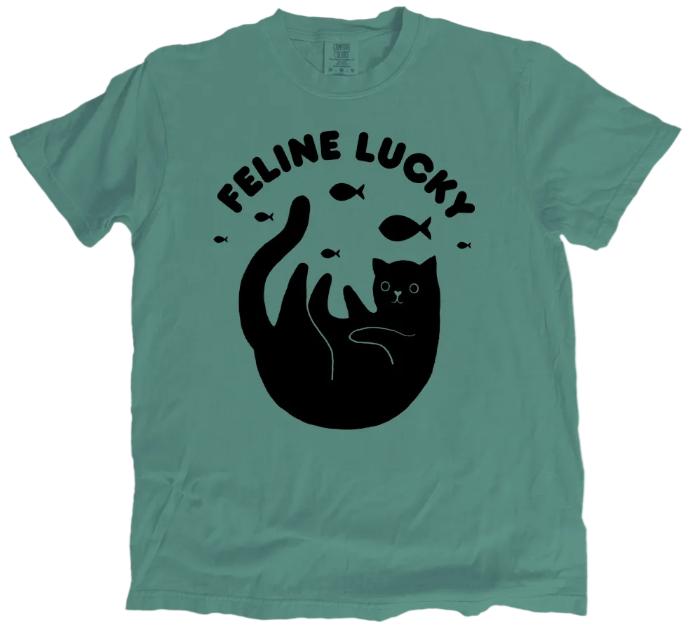 Green t-shirt with black cat graphic and 'Feline Lucky' text on a white background