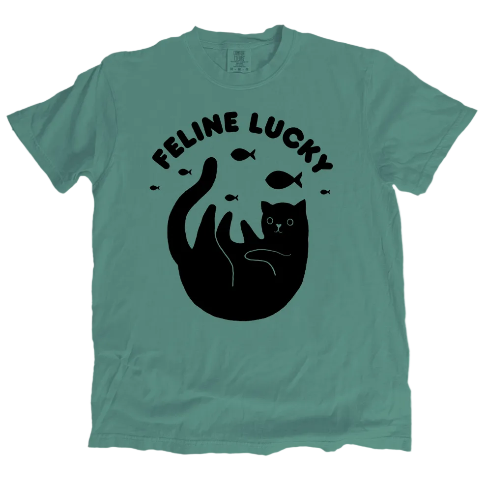Green t-shirt with black cat graphic and 'Feline Lucky' text on a white background