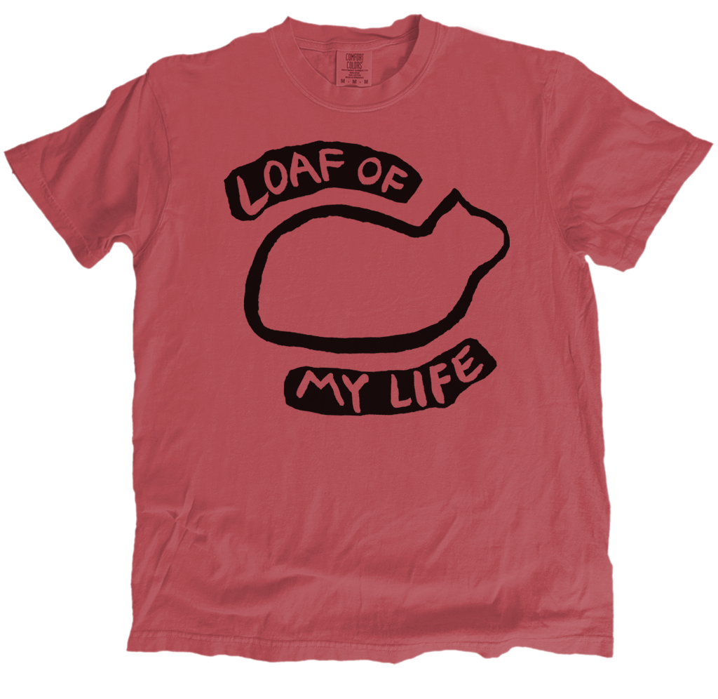Red t-shirt with black graphic and text 'Loaf of My Life' on a white background