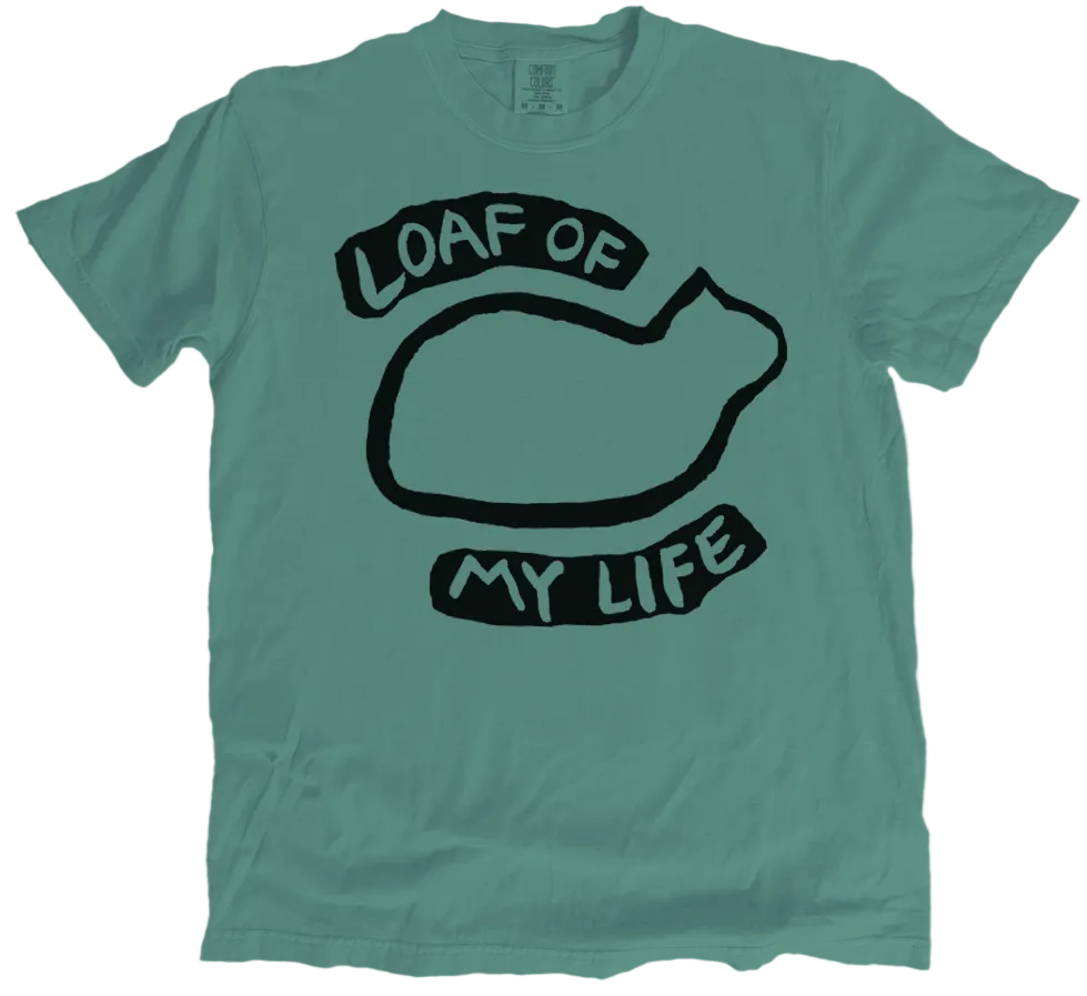 Green t-shirt with black graphic and text 'Loaf of My Life' on a white background