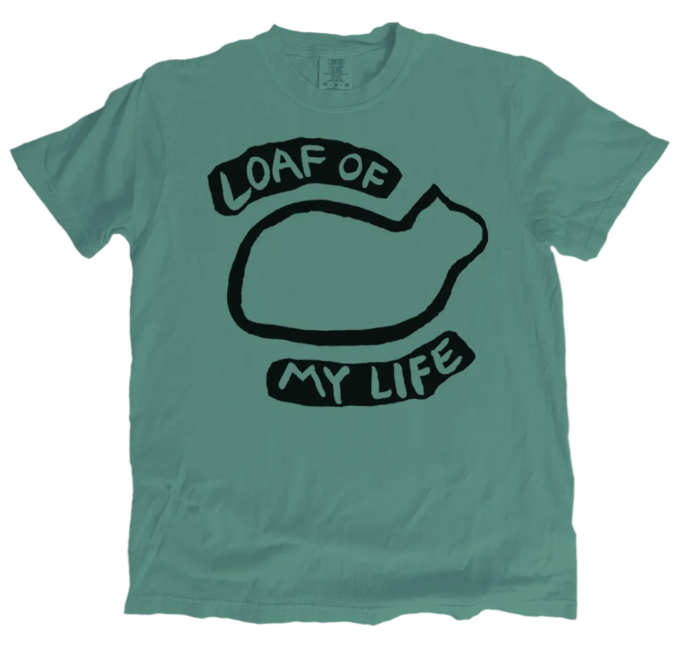 Green t-shirt with black graphic and text 'Loaf of My Life' on a white background