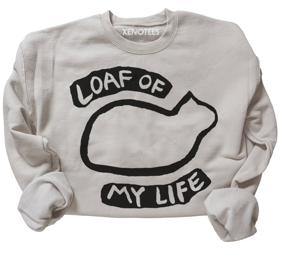 Beige sweatshirt with black graphic and text 'LOAF OF MY LIFE' on a white background