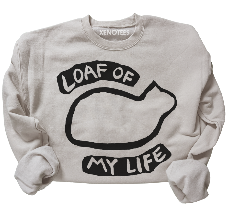 Beige sweatshirt with black graphic and text 'LOAF OF MY LIFE' on a white background
